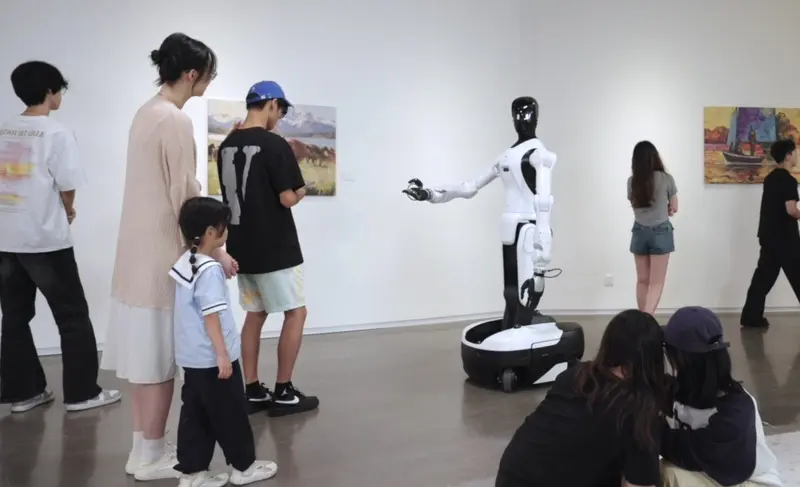 A AgiBot G2 robot gives a gallery tour