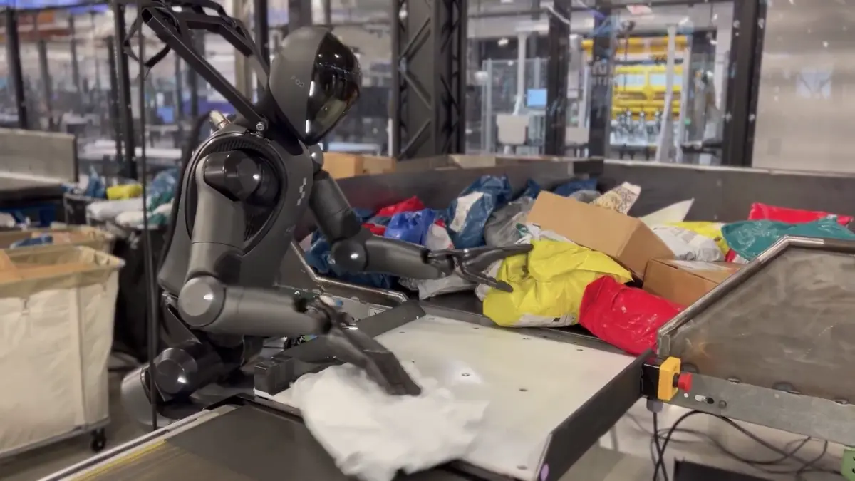 A Figure AI humanoid robot sorting packages