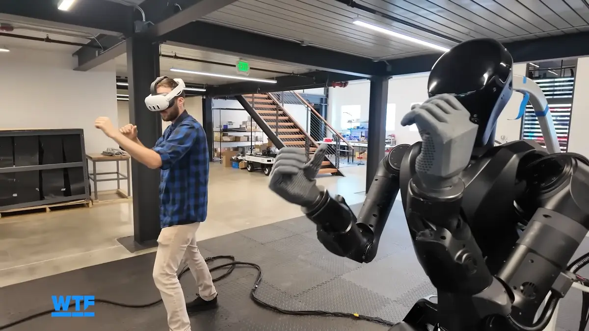 CNET reporter controlling the Phantom MK1 humanoid robot with a VR headset.
