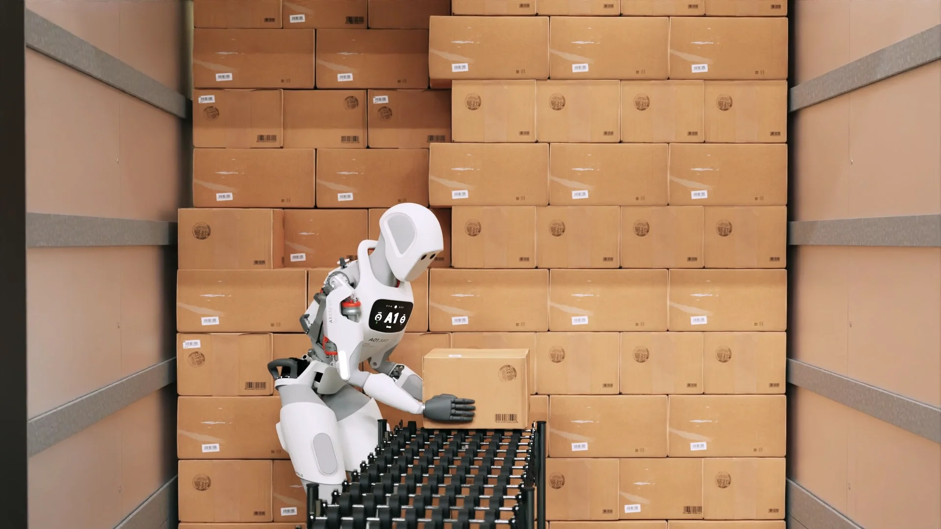 A sleek white bipedal humanoid robot is shown inside a shipping container or trailer, carefully placing a cardboard box onto a conveyor belt system. The robot features a digital chest display and articulated hands.