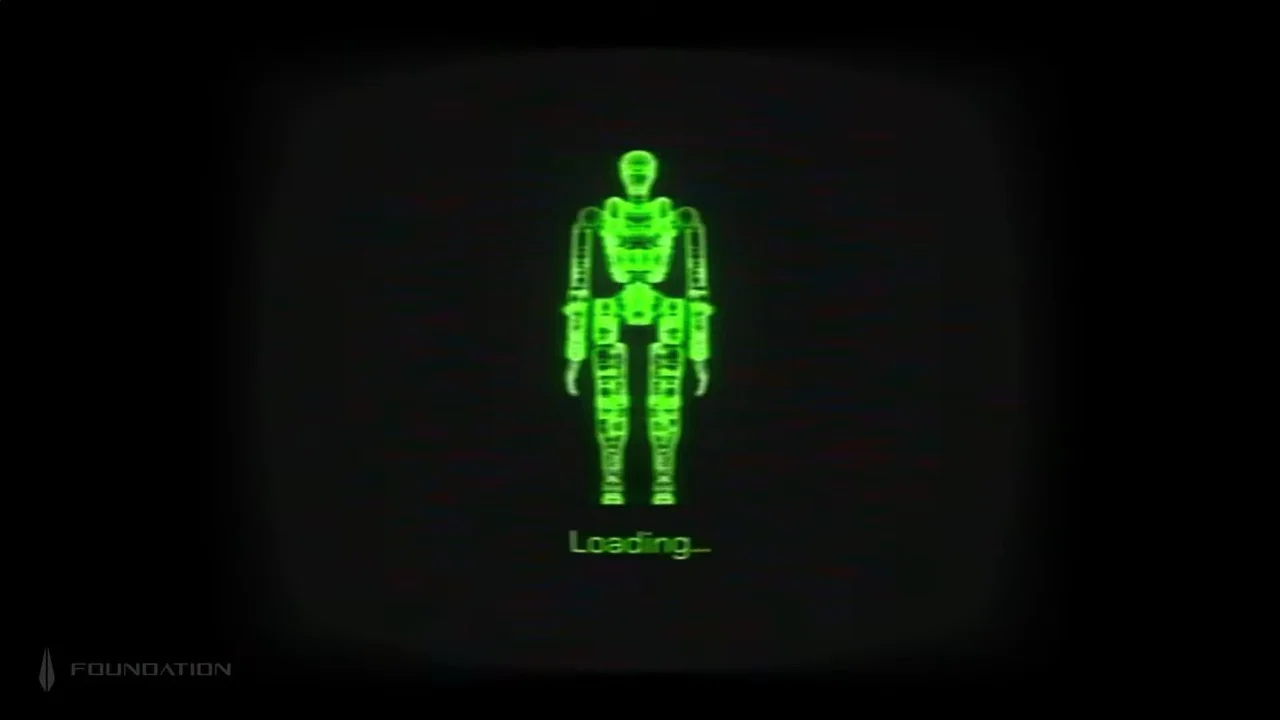 A full-body digital representation of a humanoid robot rendered in glowing green against a black background. The interface features a retro 1980s aesthetic with visible scan lines, a grainy texture, and the word "Loading..." in a blocky digital font beneath the figure. The Foundation company logo is visible in the bottom-left corner.