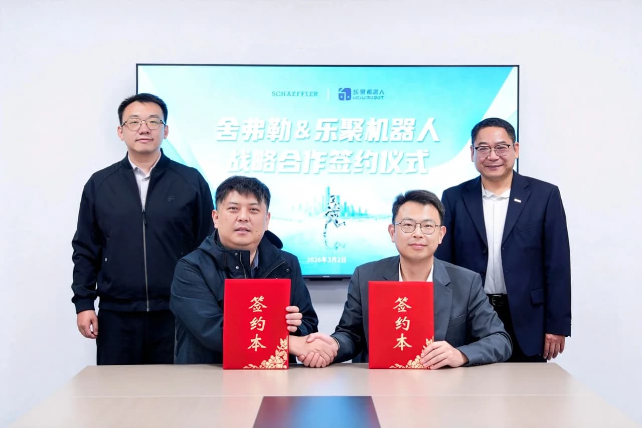 Four men pose for a photo at a partnership signing ceremony. Two men are seated in the foreground, shaking hands while holding red folders with gold Chinese characters. Two other men stand behind them. In the background, a large digital screen displays the logos of Schaeffler and Leju Robotics, along with Chinese text and the date 2026-03-02.